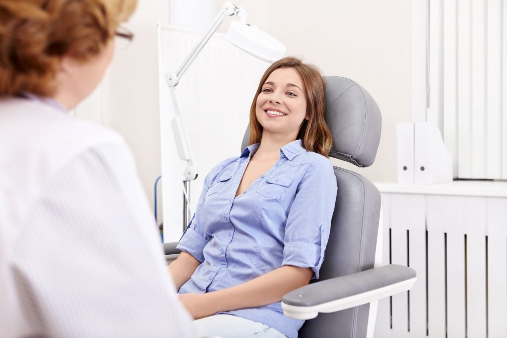 Woman sitting in a patient chair